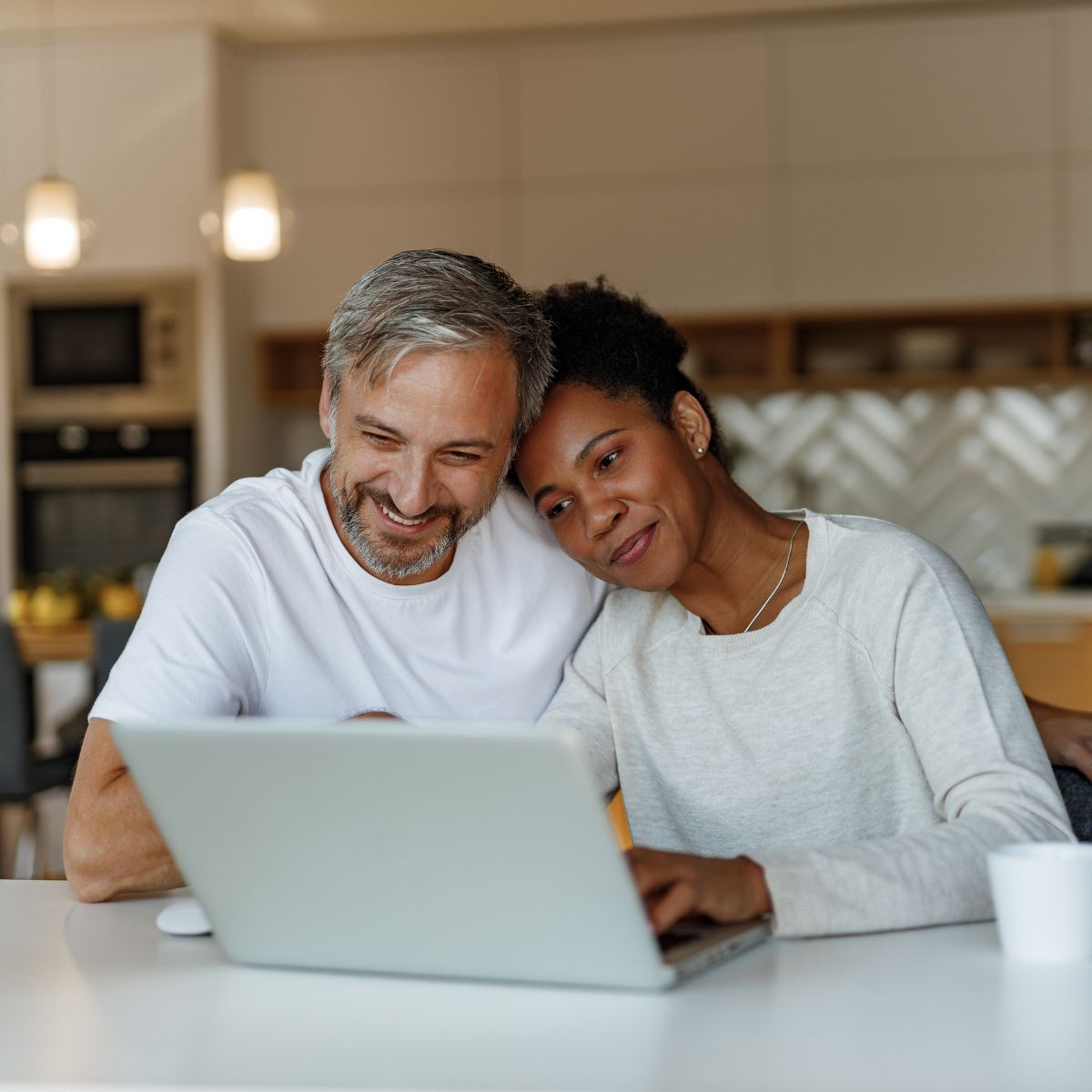 Couple looking at laptop