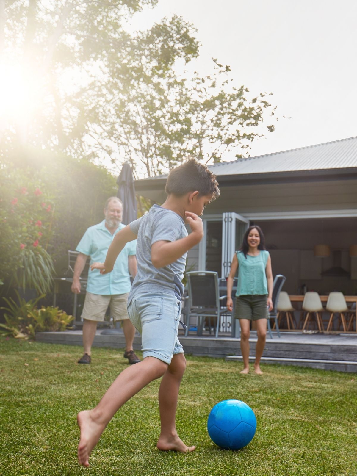 Family playing soccer