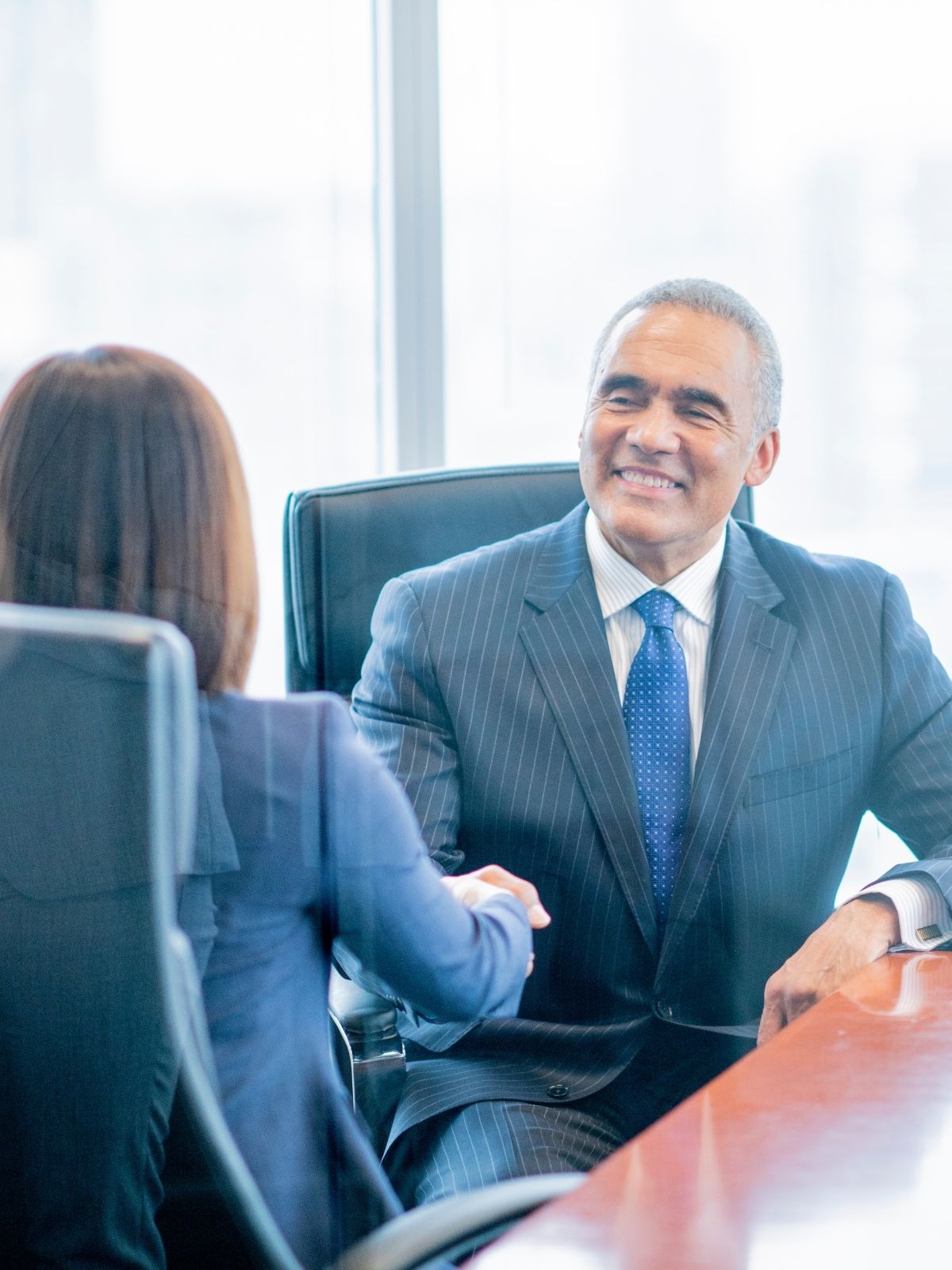 Man and woman professionals shaking hands